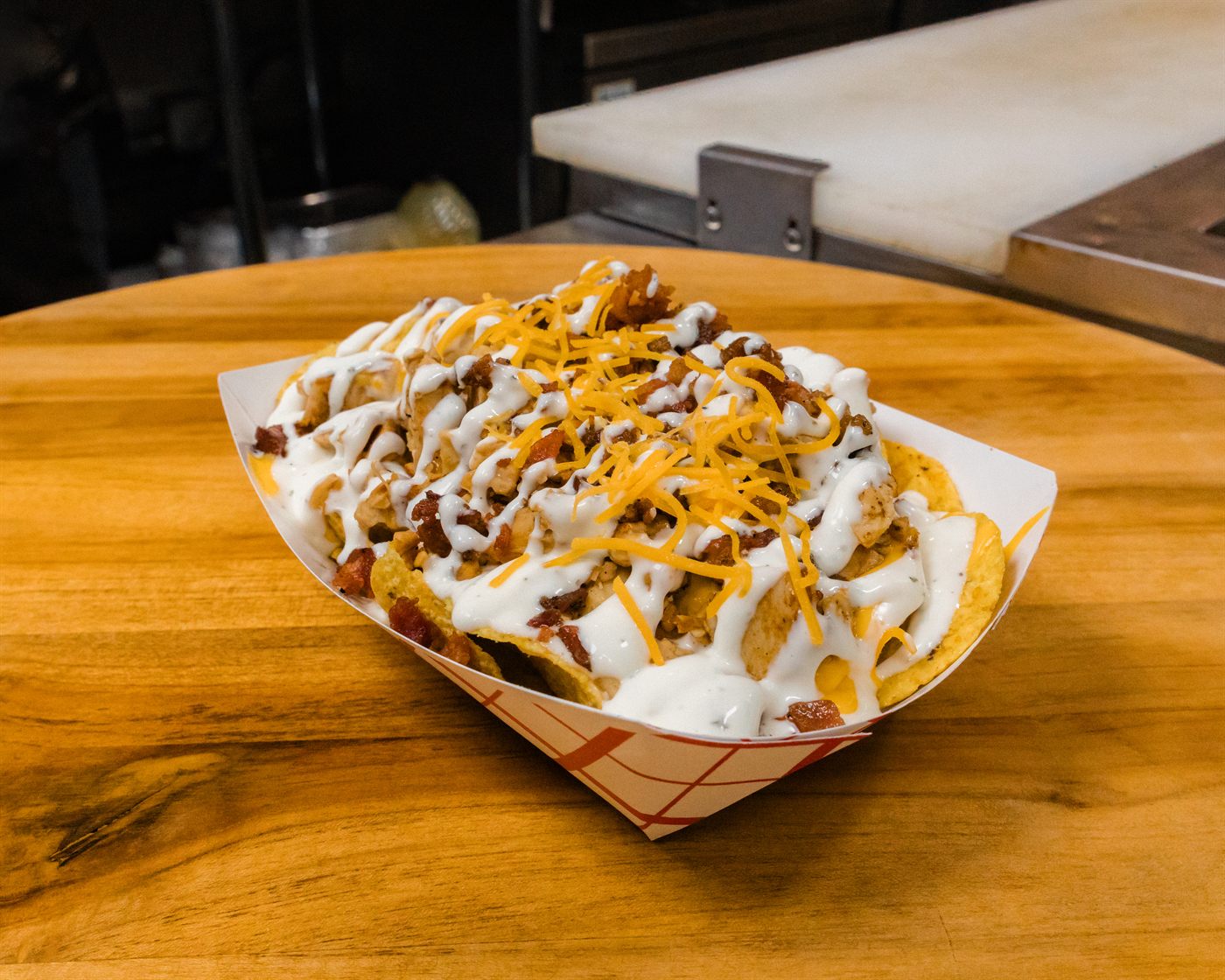 Loaded potato bowl with ranch, bacon, cheese, and chicken